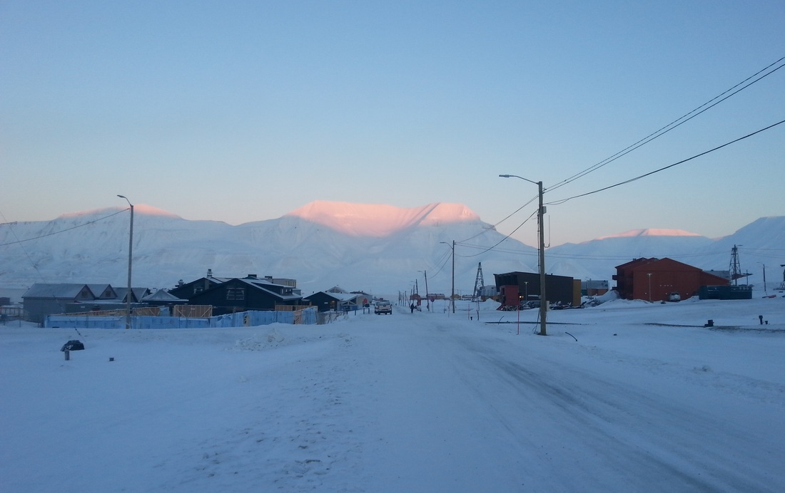 Sunshine on top of distant mountains
